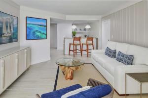 a living room with a white couch and a table at Bahia Mar Fort Lauderdale Beach - DoubleTree by Hilton in Fort Lauderdale