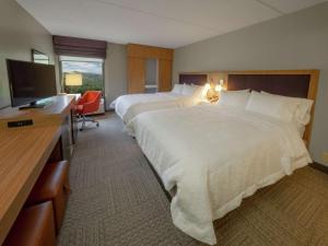 Voodi või voodid majutusasutuse Hampton Inn Hazleton toas