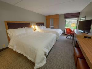 Voodi või voodid majutusasutuse Hampton Inn Hazleton toas