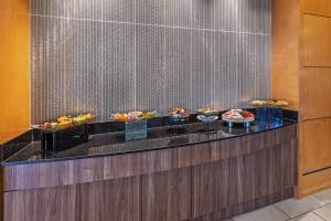 a buffet in a hotel room with food on display at Embassy Suites by Hilton Houston-Energy Corridor in Houston +34 photos