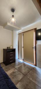 a room with a large sliding doors in a room at La casa de Boris 1 in Ushuaia