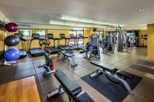 a gym with a lot of treadmills and machines at DoubleTree by Hilton San Jose in San Jose