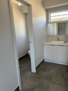 a bathroom with a sink and a toilet at Ocean Yakka, Kangaroo Island in Penneshaw