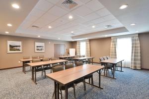 a classroom with tables and chairs in a room at Hampton Inn & Suites Menomonie-UW Stout in Menomonie