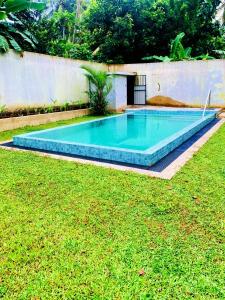 a swimming pool in the middle of a yard at Happy villa (tuvaraga) 