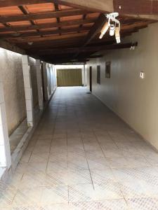 an empty room with a tile floor and a ceiling at Casa De Benedictis Rio de Contas in Rio de Contas