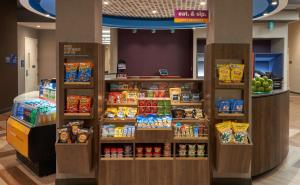 a store filled with lots of different types of food at Tru By Hilton Fort Lauderdale Downtown-Flagler Village in Fort Lauderdale