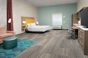 Home2 Suites By Hilton Clovis Fresno Airport客房内的一张或多张床位