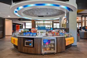 a food counter in a store with food and drinks at Tru By Hilton Auburn, In in Auburn