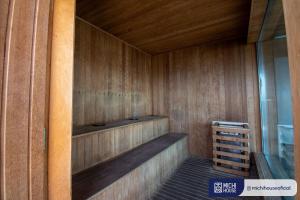 a wooden sauna with a bench in a room at MH 10002 - Lindo Studio com WF/AC/Cama Casal in Sao Paulo