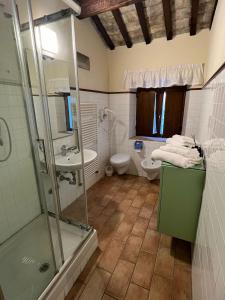 a bathroom with a shower and a sink and a toilet at Locanda del Tavolo Matto in Potenza Picena