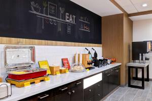 a kitchen with a counter with many items on it at Hampton Inn & Suites Houston East Beltway 8, Tx in Houston