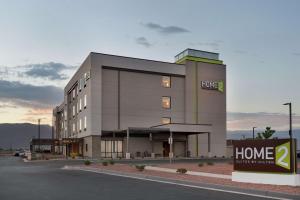 a building with a home sign in front of it at Home2 Suites By Hilton Alamogordo White Sands in Alamogordo