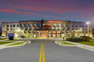 an empty parking lot in front of a hotel at Hampton Inn & Suites Alachua I-75, FL in Alachua