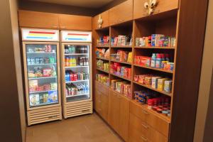 a pantry with two refrigerators and lots of food at Best Western Heritage Inn & Suites in Broussard