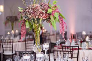 a vase filled with flowers on a table at Hilton Fairfax, Va in Fairfax