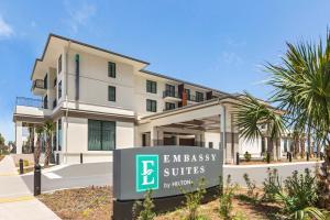 a building with a embassy suites sign in front of it at Embassy Suites By Hilton Panama City Beach Resort in Panama City Beach