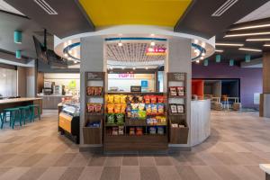 a grocery store with a display of food at Tru By Hilton Fayetteville Fort Bragg in Fayetteville