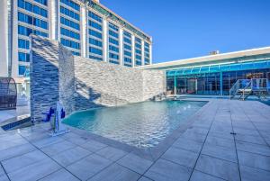 a swimming pool in front of a building at DoubleTree by Hilton Houston Brookhollow in Houston