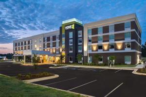 una rappresentazione di un hotel con parcheggio di Home2 Suites By Hilton Fayetteville North a Fayetteville