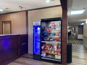 a refrigerator filled with food in a hallway at Best Western Halito Inn in Calera