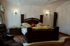 a bedroom with a bed with a teddy bear on it at Luxury Villa in Rehab City in Cairo