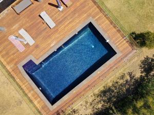an overhead view of a swimming pool on a wooden deck at Top Class Rye in Rye