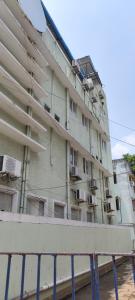 a tall building with balconies on the side of it at Stayz Inn Hotels - T nagar Chennai Near Pondy Bazzar in Chennai