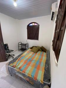 Sítio Curumim - Zohra tesisinde bir odada yatak veya yataklar