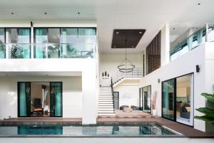an image of a house with a swimming pool at Itz Time Hua Hin Pool Villa in Hua Hin