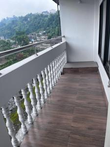 a balcony with a view of a mountain at BKR Homestay 1BH in Itānagar