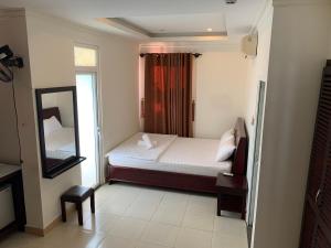 Кровать или кровати в номере Nhu Ngoc Homestay