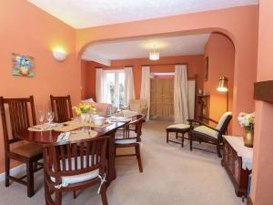 a dining room with a table and chairs at Sea Pearl in Lowestoft