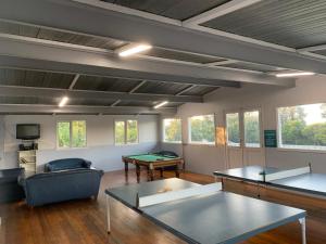 a living room with couches and a pool table at Beach Park Phillip Island - Apartments in Cowes