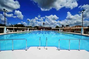 a large swimming pool on top of a hospital at Carmen’s Casita in Tampa