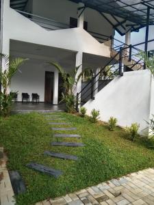 a pathway leading to the front of a house at Happy villa (tuvaraga) 