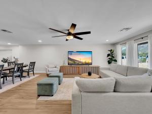 a living room with a couch and a ceiling fan at 20th Phoenix home in Phoenix