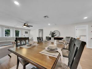 a dining room and living room with a table and chairs at 20th Phoenix home in Phoenix