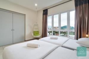 Postel nebo postele na pokoji v ubytování JOMSTAY Octagon Ipoh Suites + 37 fotografií