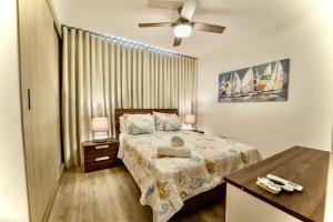 เตียงในห้องที่ Scenic View Apartment in Downtown Punta Cana