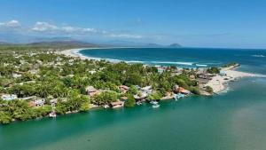 an aerial view of a resort with a beach at Casa Laud Chacahua Isla in Guayabas