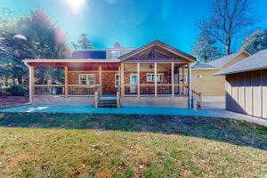 a home with a large front porch and a house at Brevard Bungalow in Brevard