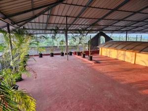 a large building with plants in the middle of it at Hamsted in Kottakkal