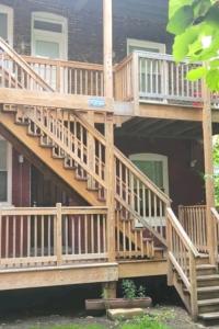 a deck with stairs on a house at Chateau de Woodlawn - Room III - The Dream Catcher in Chicago