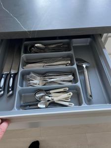 a tray filled with utensils in a drawer at Casa Home of Bricks - Downtown Holidays in Billund