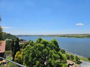 a view of a body of water with trees at Eagles View Kungwini in Erasmus