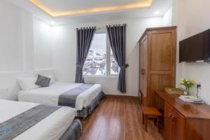 Postel nebo postele na pokoji v ubytování Cara Hostel & Spa