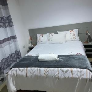 Кровать или кровати в номере Rockville Abode