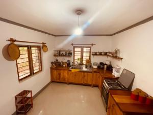 a kitchen with a light on the ceiling at Rockville Abode in Iringa