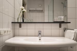 Koupelna v ubytování Hotel Au Quartier